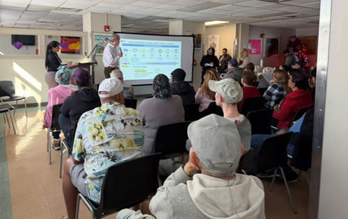 An image of a person giving a power point presentation